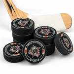 Stack view of the Stampede Hockey Puck with a hockey stick on white background